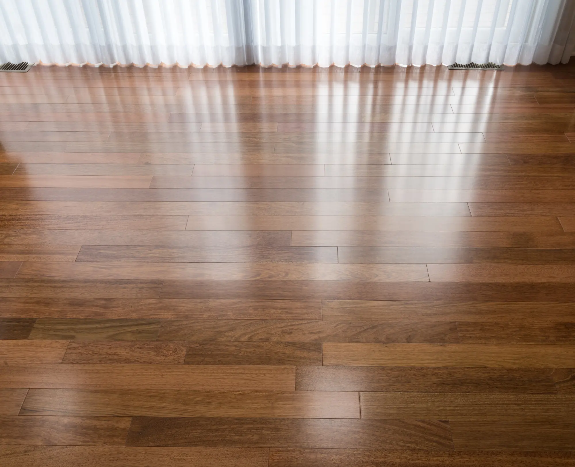 vertical-blinds-cast-shadows-newly-installed-brazilian-cherry-hardwood-floor-scaled